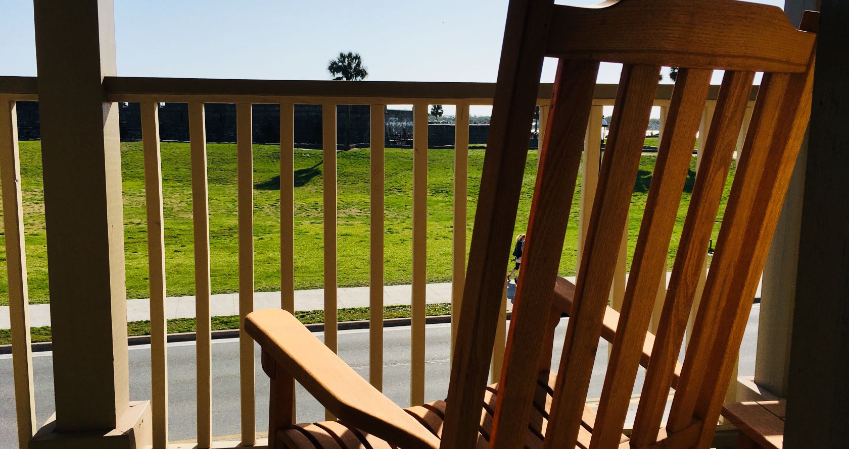 A Chair Sitting In Front Of A Wooden Fence